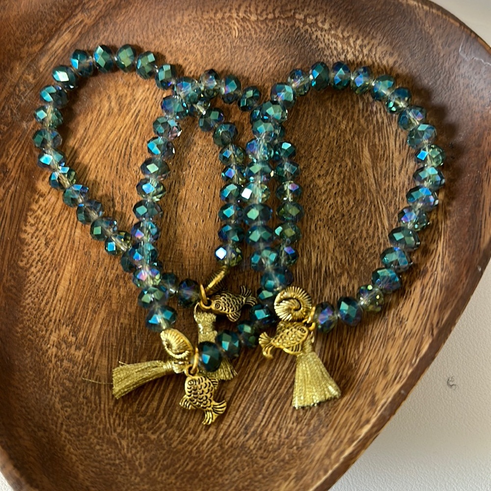 Gorgeous beaded bracelet with gold tassel and charms